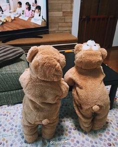 two teddy bears standing on their hind legs