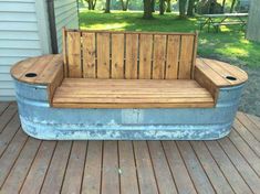 a wooden bench sitting on top of a wooden deck