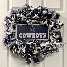 a cowboys wreath hanging on the front door