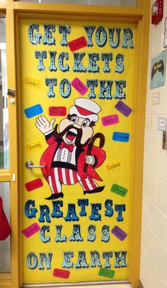 a classroom door decorated with magnets and writing that says, get your tickets to the greatest class on earth