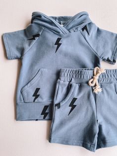 dusty blue lightning hooded set short sleeve hooded top with pocket matching shorts with stretchy waistband soft, stretchy material 95% organic cotton, 5% spandex Blue Lightning, Matching Mom, Toddler Boy Fashion, Baby Boy Onesies, Hooded Top, Toddler Clothing, Toddler Fun, Baby And Toddler, Hooded Tops