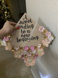 someone is holding up a graduation cap that says, sweet ending to a new beginning