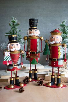 three nutcrackers are standing next to each other