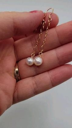 These gorgeous earrings are meant to hang mid length from your ear. Made with freshwater pearls, gold filled chain and findings. Queen Of Heaven And Earth, Diy Pearl Jewelry, Diy Jewelry Ideas, Pearl Earrings Designs, Wire Wrapped Jewelry Diy, Fancy Jewelry Necklace, Queen Of Heaven, Beaded Earrings Diy, Heaven And Earth