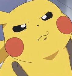 a close up of a pikachu looking at something with eyes wide open in front of him