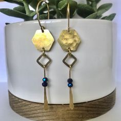 These pretties have been hammered with love! Every piece of raw brass on these unique earrings have been hammered & texturized to make them glimmer & glow! Hexagons & squares give these a geometric modern design.  Nickel free & so comfortable. Nickel Free Gold Hexagon Jewelry, Blue Hammered Dangle Jewelry, Gold Brass Jewelry With Faceted Beads, Gold Faceted Brass Earrings, Bead Dangles, Long Gold Earrings, Face Earrings, Gold Earrings Dangle, Brass Earrings