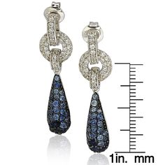 These Caribbean Blues earrings by Suzy Levian feature 120 paved natural blue sapphires and created white sapphires and a secret brown diamond. This pair of earrings also features a beautiful closed back-gallery with an 18-karat solid gold SL logo and are crafted in sterling silver. These earrings are designed by Suzy Levian with a message. By creating jewelry that is beautiful inside and out, Suzy Levian's message is revealed through a hidden stone set in the back of these earrings to empower wo Sl Logo, Cubic Zirconia Earrings, Creating Jewelry, Jewelry Rings Diamond, Zirconia Earrings, Drop Dangle Earrings, Brown Diamond, Gemstone Necklace Pendant, Natural Blue Sapphire