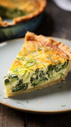 a slice of quiche on a white plate