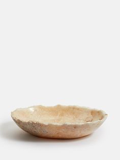 a white bowl sitting on top of a table