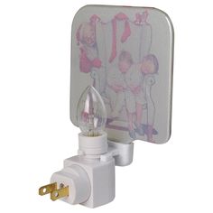 a wall mounted light with a child's picture on the side and an electrical outlet