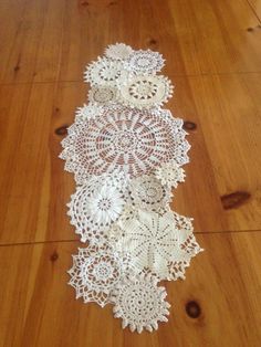 white doily sitting on top of a wooden floor