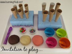 a tray with cupcakes, doughnut holes and play dough on it that says in addition to play