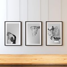 three black and white pictures hanging on the wall