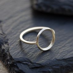 This circle ring represents the best traditions of minimalist jewelry - it is absolutely simple, but this simplicity is really beautiful. It looks gorgeous worn alone or in addition to other pieces. Wear it as a midi ring and as a regular ring - it will look awesome anyway. The ring is 1 mm thick and is very sturdy although it looks very dainty on the finger. The circle is approx. 10 mm diameter, so consider that it could look different on your ring size. You may order the ring of any size. If y Midi Ring, Circle Ring, Modern Ring, Minimal Modern, Full Circle, Bangles Jewelry, Rose Gold Engagement Ring, Schmuck Design, Unique Engagement Rings