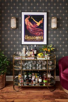 a bar cart filled with liquor bottles and glasses