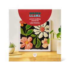 an image of a plant with flowers on it in front of a sign that says momo llama