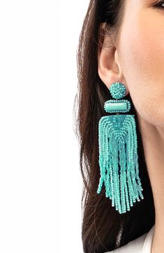 Designed to swish and sway right above the shoulders, these dramatic tassel earrings are handcrafted with shimmery beads and sparkly faux-stone accents. 3 3/4" drop; 1 1/4" width Post back Handmade Brass/glass/enamel/faux leather Imported Deepa Gurnani, Beaded Tassel Earrings, Handmade Brass, Brass Glass, Faux Stone, Fabric Gift Bags, Beaded Tassels, Keep Jewelry, Fabric Gifts