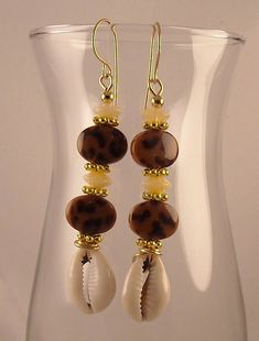 Bohemian Gold Beaded Earrings With Ear Wire, Gold Bohemian Beaded Earrings With Ear Wire, Unique Brass Beaded Earrings With Round Beads, Brown Round Bead Earrings For Festivals, Bohemian Copper Beaded Earrings, Bohemian Copper Beaded Earrings With Round Beads, Bohemian Bronze Earrings With Round Beads, Bohemian Gold Round Bead Earrings, Bohemian Brown Jewelry With Spacer Beads