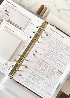 an open planner sitting on top of a table