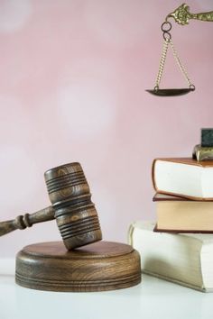 a wooden gaven sitting on top of two books