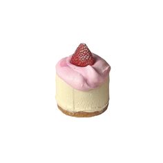 a piece of cheesecake with pink icing and a strawberry on top, sitting on a white surface