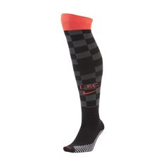 a pair of black and orange socks with red accents on the bottom, one sock has a checkerboard pattern