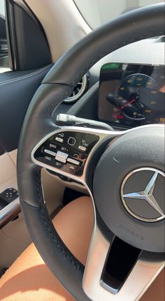 the steering wheel and dashboard of a car