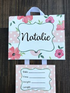 a sign that says natalie on it next to a bag with a name tag attached