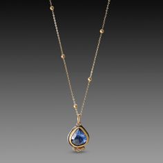 A stunning, deep blue, rose cut sapphire, wrapped in 22k gold shines with a trio of diamond accents, each set in a 22k gold dot. This lovely pendant is suspended from a 14k gold dot chain, with 14k lobster clasp. Setting measures approximately 3/8 inch x 1/2 inch. Sterling silver back. matte finish. Necklace With Diamonds, Gold Dot, Gemstone Necklaces, Gold Dots, Teardrop Necklace, Sapphire Necklace, Blue Rose, 22k Gold, Rose Cut