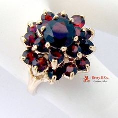 Three Tiered 14K Gold Garnet Cocktail Ring Classic Ruby Ring With 17 Jewels, Antique 14k Gold Cluster Ring, Red Cluster Ring Stamped 14k, Formal Cluster Ruby Ring Stamped 14k, Collectible Cluster Ring With Brilliant Cut, Fine Jewelry 14k Gold Cluster Ring, Red 14k Stamped Cluster Ring, 14k Gold Round Cluster Ring Fine Jewelry, 14k Gold Round Cluster Ring In Fine Jewelry Style