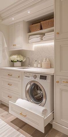 a white washer sitting inside of a kitchen