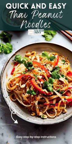 a plate with noodles and vegetables on it next to chopsticks