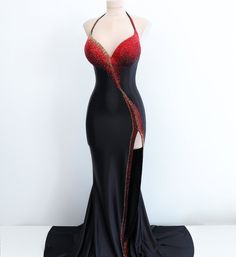 The daring combination of black satin, scarlet, and gold rhinestones creates a striking allure. The dress features an impeccable contour that elegantly embraces the figure, while its carefully curated design adds an air of refinement. This striking gown is a true embodiment of glamour and allure, guaranteed to leave a lasting impression. Production time excluding delivery: finished design - 4-5 weeks; custom design 2-3 months. ----------------------------------------------------- We invite you t Fitted Satin Evening Dress For Red Carpet, Elegant Black Dress For Red Carpet, Black Satin Gown For Gala, Formal Black Gown With Rhinestones, Black Rhinestone Dress For Prom Season, Black Fitted Dress For Red Carpet, Black Rhinestone Gown For Evening, Gold Formal Dress With Rhinestones, Gold Dress With Rhinestones For Formal Occasions