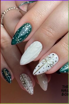 Get ready to sleigh with these Festive Green and White Sweater Nails! 🎄✨ Adorned with silver starbursts and delicate gold bows, the deep emerald green base and pearly white sweater nails beautifully capture the essence of Christmas. With black polka dots adding a touch of playful elegance, this manicure is the perfect gift to yourself this holiday season! 🎁💅 // Photo Credit: Instagram @thenailboxbasingstoke Green Christmas Nails, Nail Art Noel, Festive Manicure, Whimsical Patterns, Red Christmas Nails, Sweater Nails, Nail Design Inspiration, Christmas Nail Art Designs