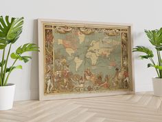 an old world map is hanging on the wall next to potted plants