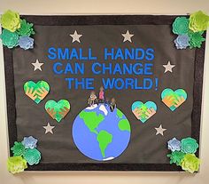 a bulletin board that says small hands can change the world with hearts and stars on it