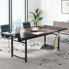 an office desk with chairs and a potted plant