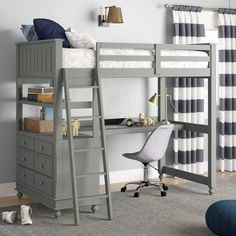 a gray bunk bed with desk and drawers