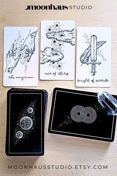 four cards with different designs on them and the words moondusts studio written in black ink