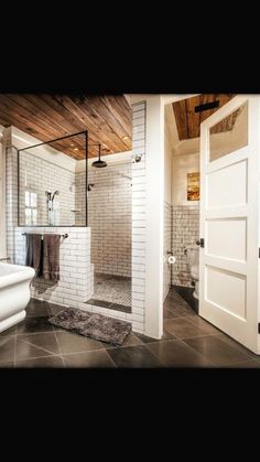 a bathroom with a shower, toilet and sink in it's center piece is shown