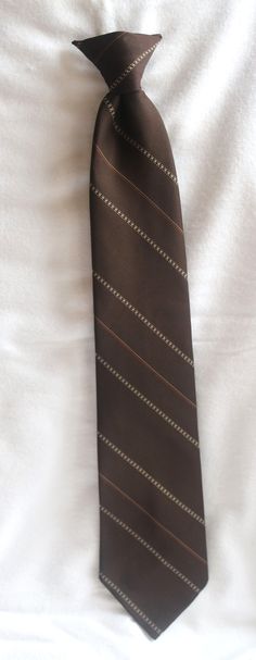 "Vintage Ketch  Mens Tie Necktie Clip On Formal Necktie Stripe Tie brown tan and Light Brown stripes Measures approximately:  17 1/2\" Long x 3 1/2\" Wide Polyester Unique vintage gift for him.  It is in nice condition, clip on tie. Please expect pilling, and stray threads that may not be noted.  The color may differ slightly from the pictures.  Vintage ties could have wear due to use an age. Please look at the pictures as this is the actual item i am selling.  I did not see any marks, or stains Official Clothes, Vintage Ties, Brown Tie, Mens Tie, Striped Tie, Tie Accessories, Suit And Tie, Fit Check, Vintage Gifts