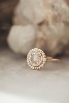 a diamond ring sitting on top of a table