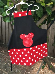 a minnie mouse apron hanging from a tree