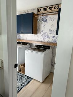 the laundry room is clean and ready to be used as a washer and dryer