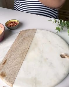 a cutting board sitting on top of a white counter