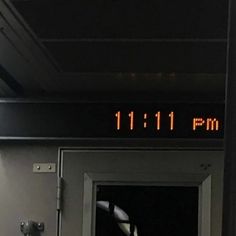 an exit sign with the time 11 11 pm