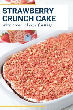 strawberry crunch cake with cream cheese frosting in a white baking dish on a table