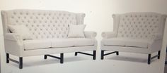 two white couches sitting next to each other