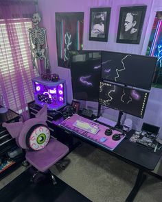 a computer desk topped with lots of electronics