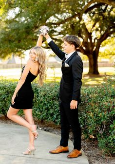 a man in a tuxedo and woman in a short black dress